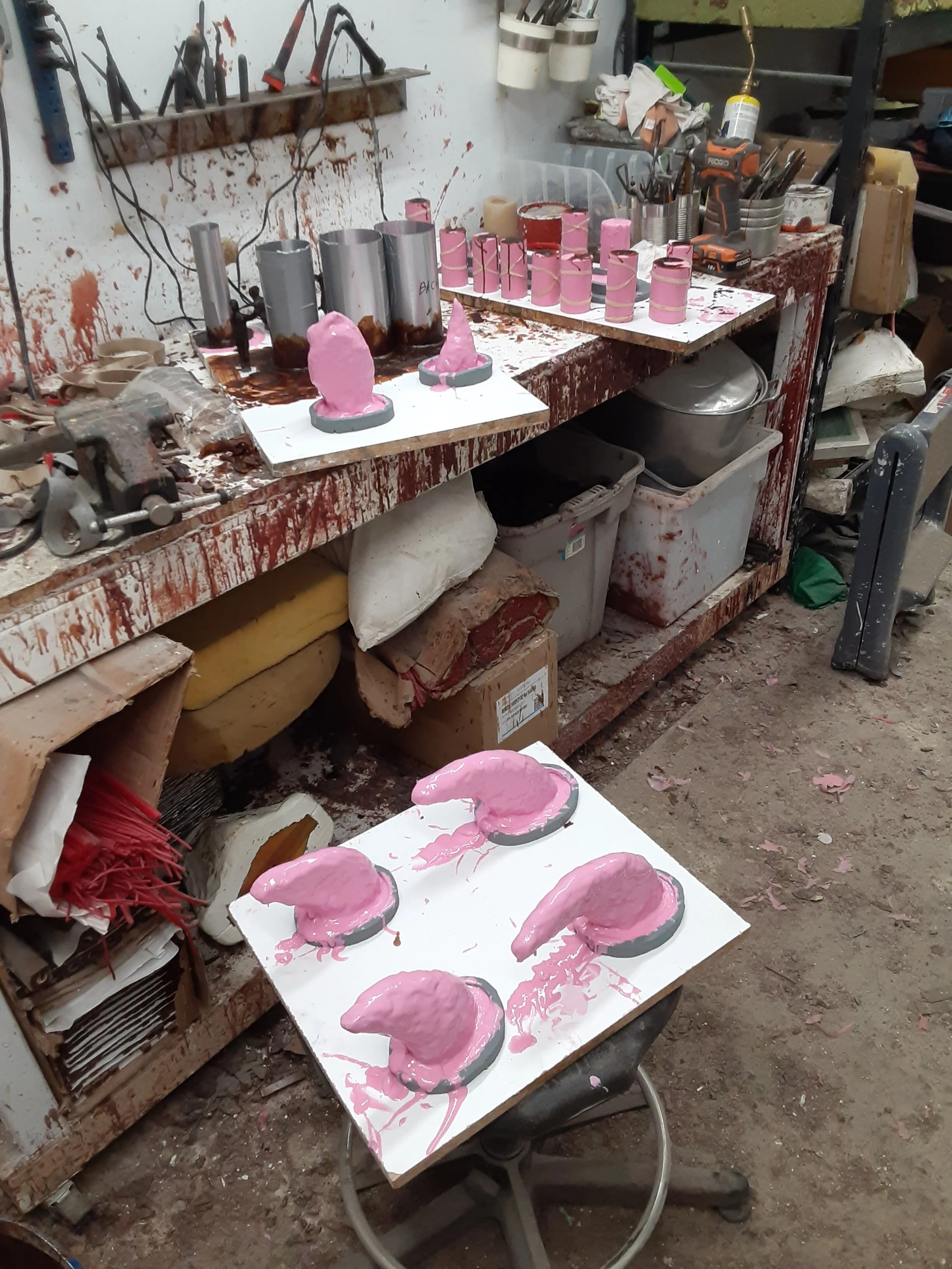 Rubber molds on turtle feet tail head and figures in the background .jpg