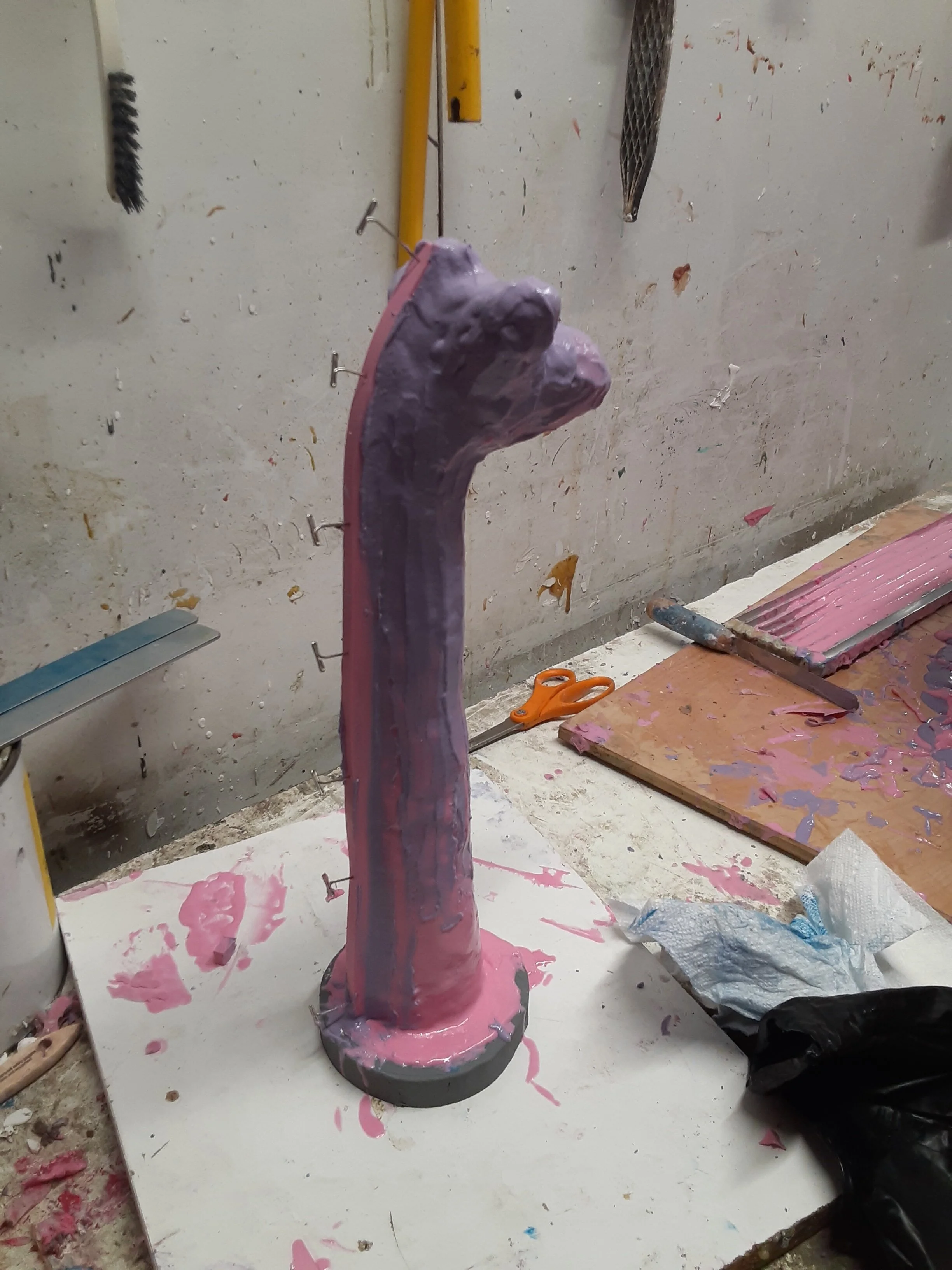 Wax positive giraffe head covered with rubber for the mold.jpeg