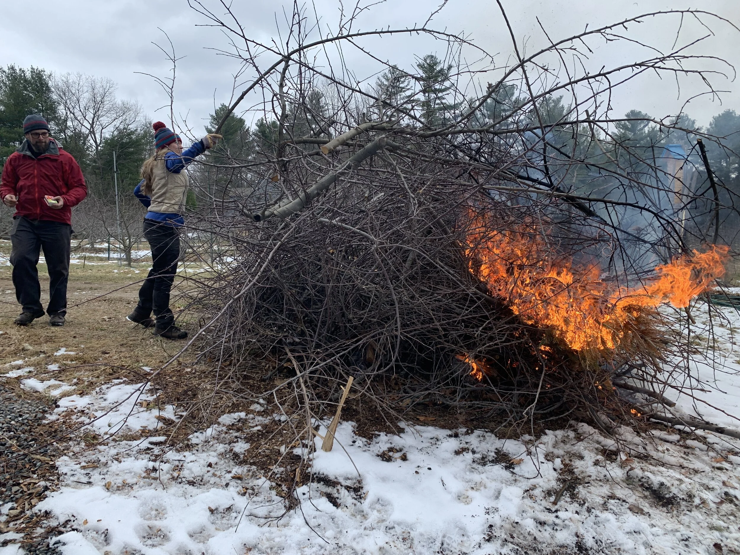 Ethan and Ariel lighting the fire.