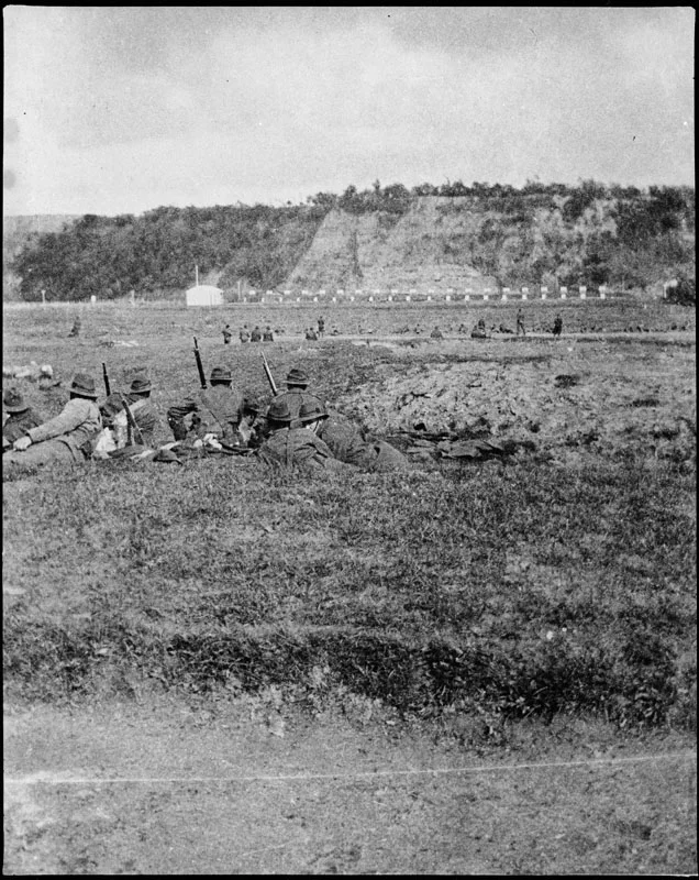 Figure 4: The flat land on the northern bank of the Manawatu River was used as a rifle range for troops training for the First World War. In the distance are the cliffs of soon-to-be ANZAC Park, circa. Reference: Pataka Ipurangi 2009N_A30_WAR_2196, Ian Matheson City Archives.
