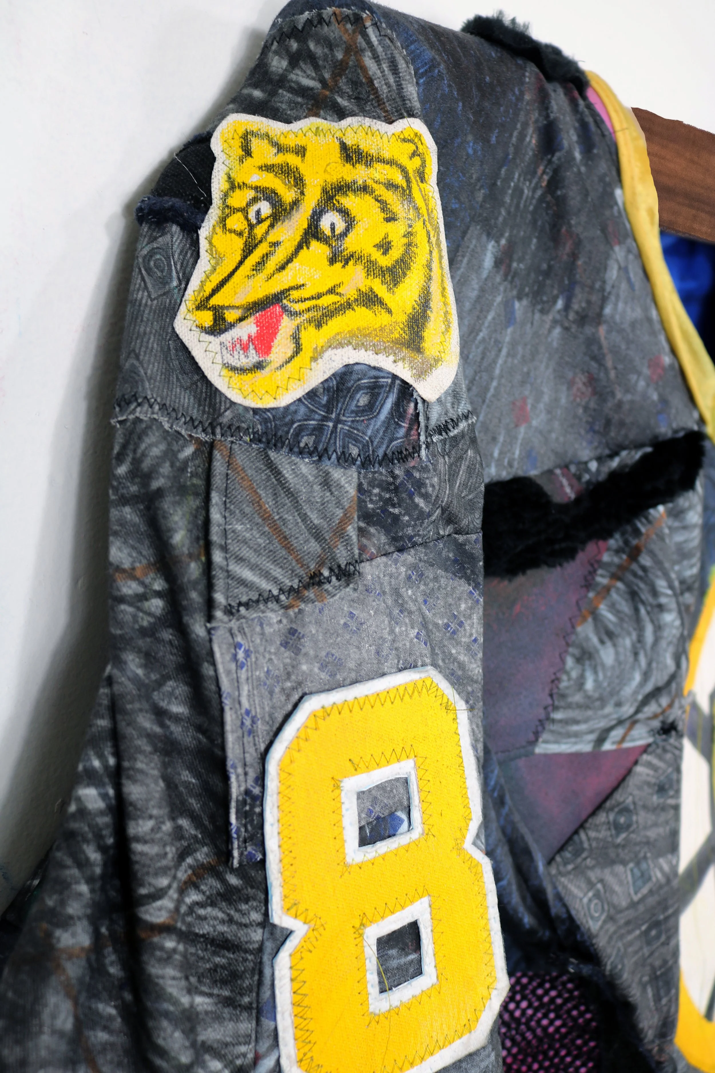 Neely_sidelogodetailWoodHanger_2025.jpg