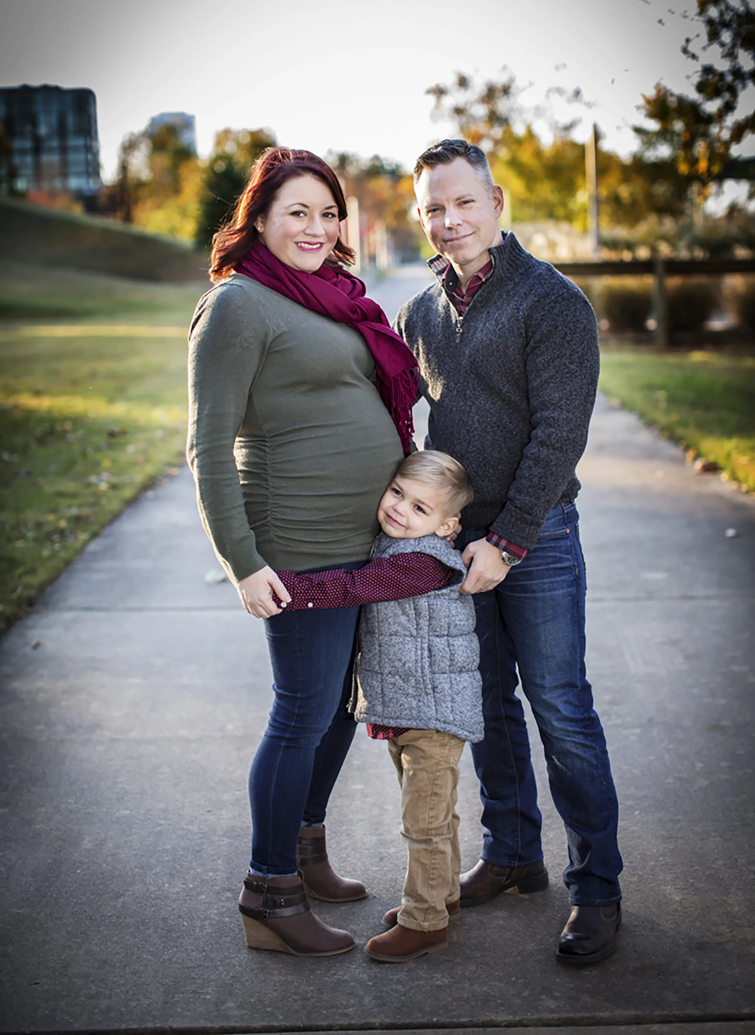 LAURA GRIMES AT 24 WEEKS WITH HUSBAND, BEN, AND SON (AND PROUD BIG BROTHER), Julian Bryant "Buzz." Photo by Jane Colclasure.