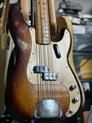 This is my old Mexican 50's Classic series P-Bass. It started life as a Fiesta Red model. Had it refinished in nitro 2-tone burst, added a QP pickup, changed the bridge to brass saddles, sanded back the neck, and added the ash tray... now it's the be