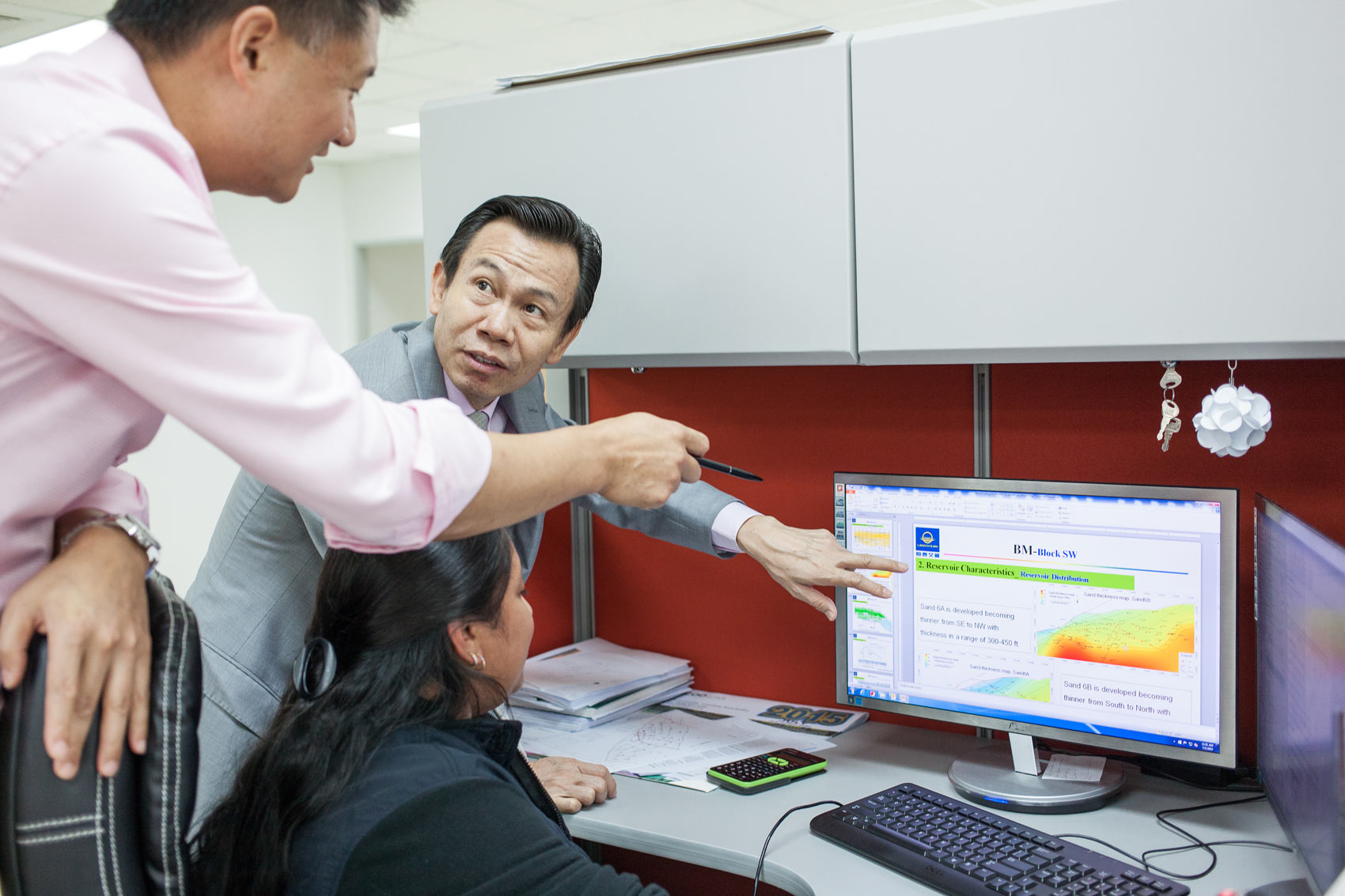LandOcean chairman Gwengwen Sun and partner David Chen review data at San Fernando headquarters. Photo by Mark Gellineau