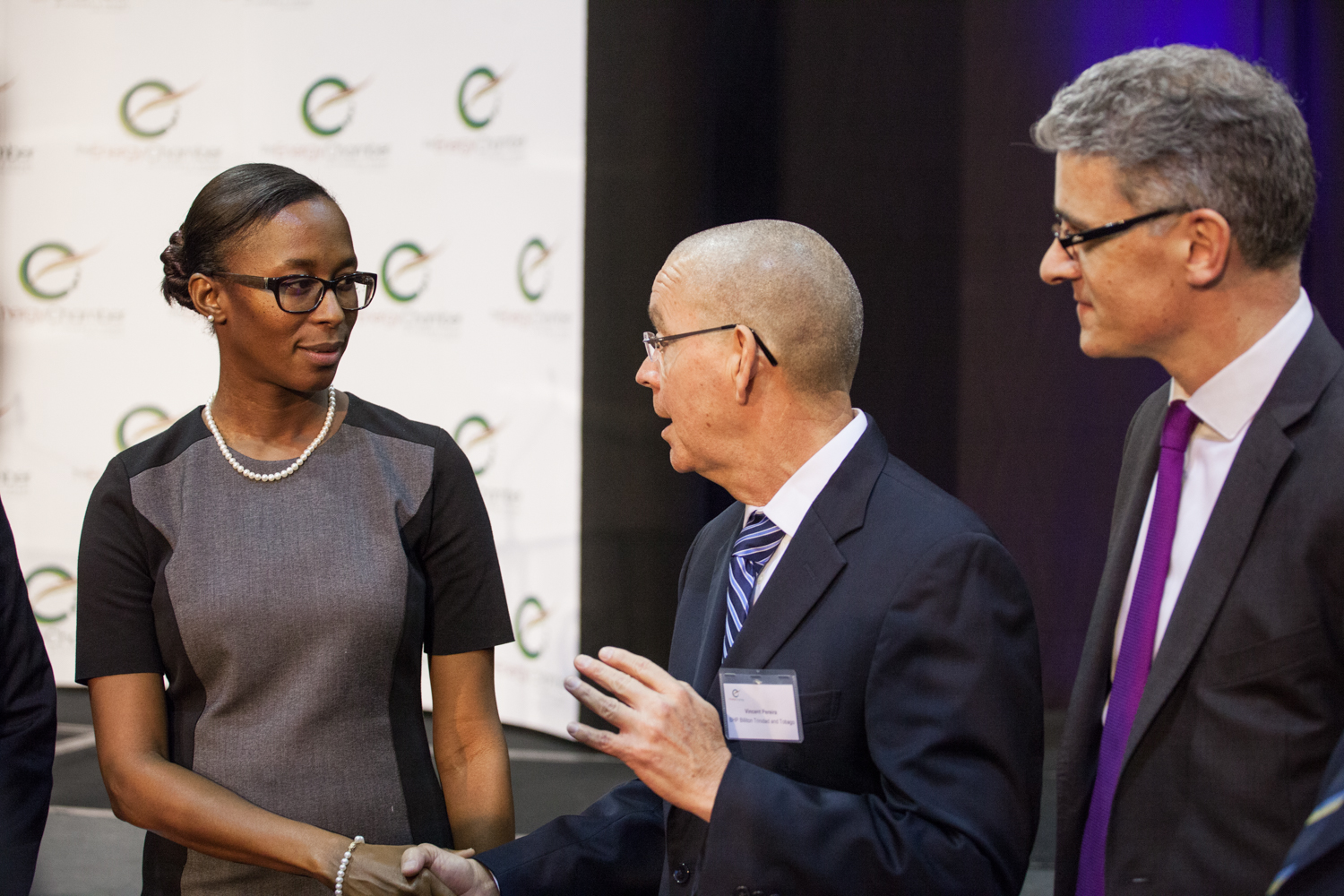 Minister of Energy and Energy Industries (MEEI) Nicole Olivierre greets Chairman of the Energy Chamber and President of BHP Billiton Vincent Pereira at the Chamber's annual general meeting Tuesday at the Hyatt Regency, Port-of-Spain. Looking on is Energy Chamber CEO Dr. Thackwray Driver. Photo by Mark Gellineau