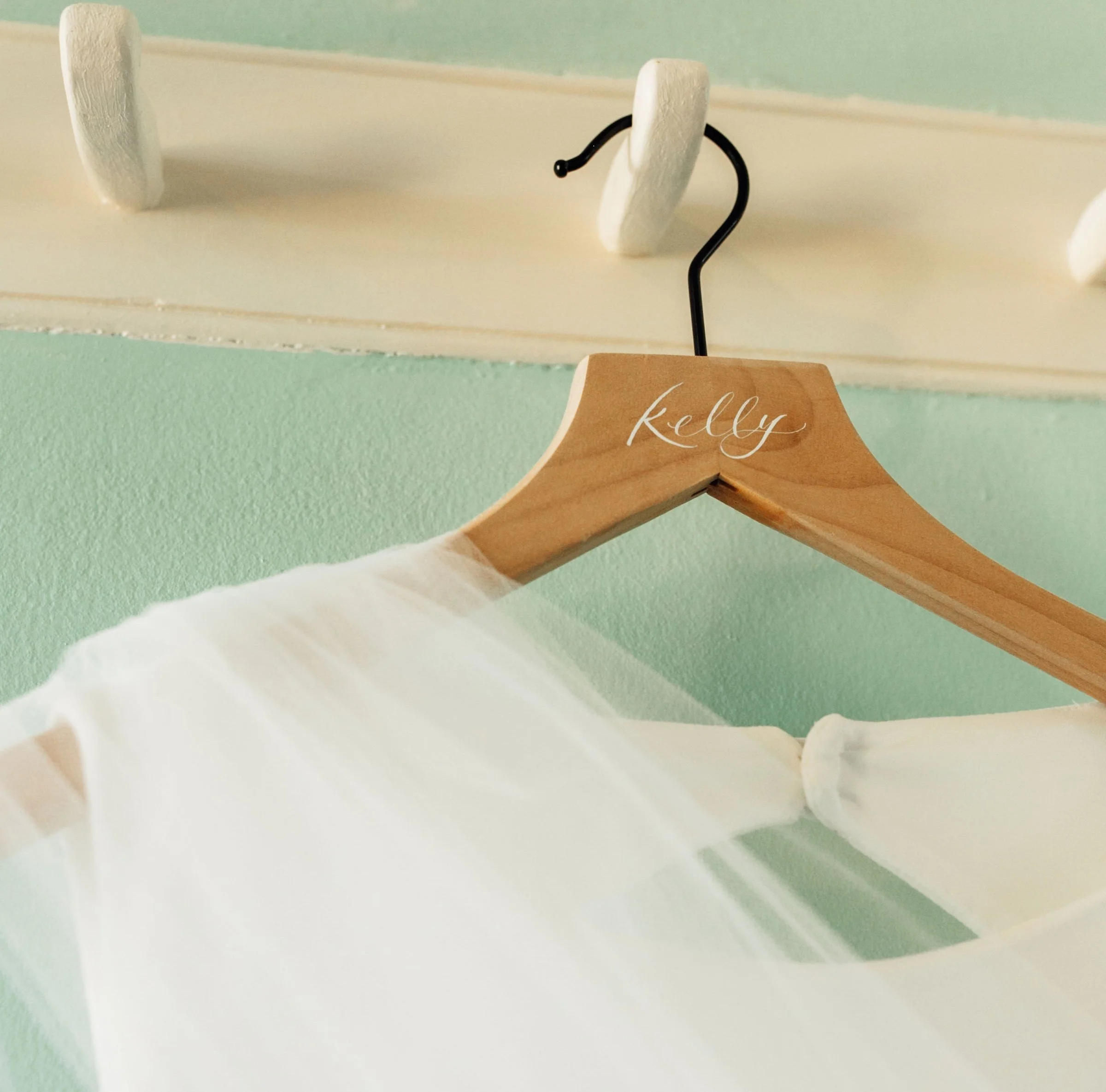 Personalized calligraphy wooden hanger with hand-lettered name