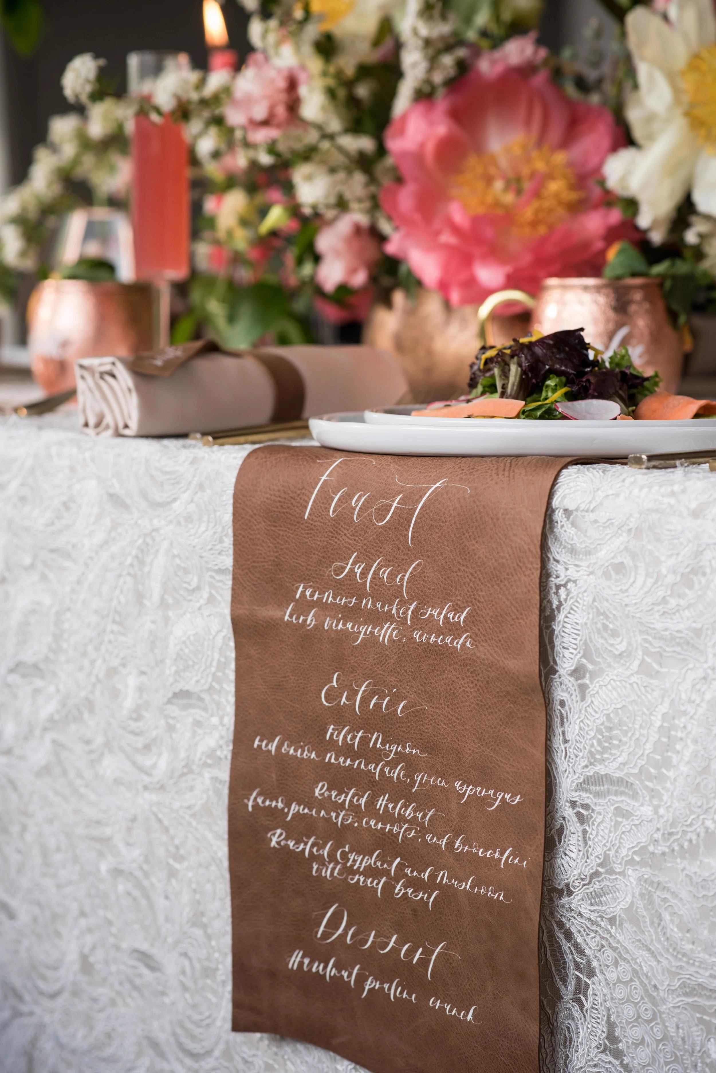Custom calligraphy hand-lettered leather menu for elegant wedding reception