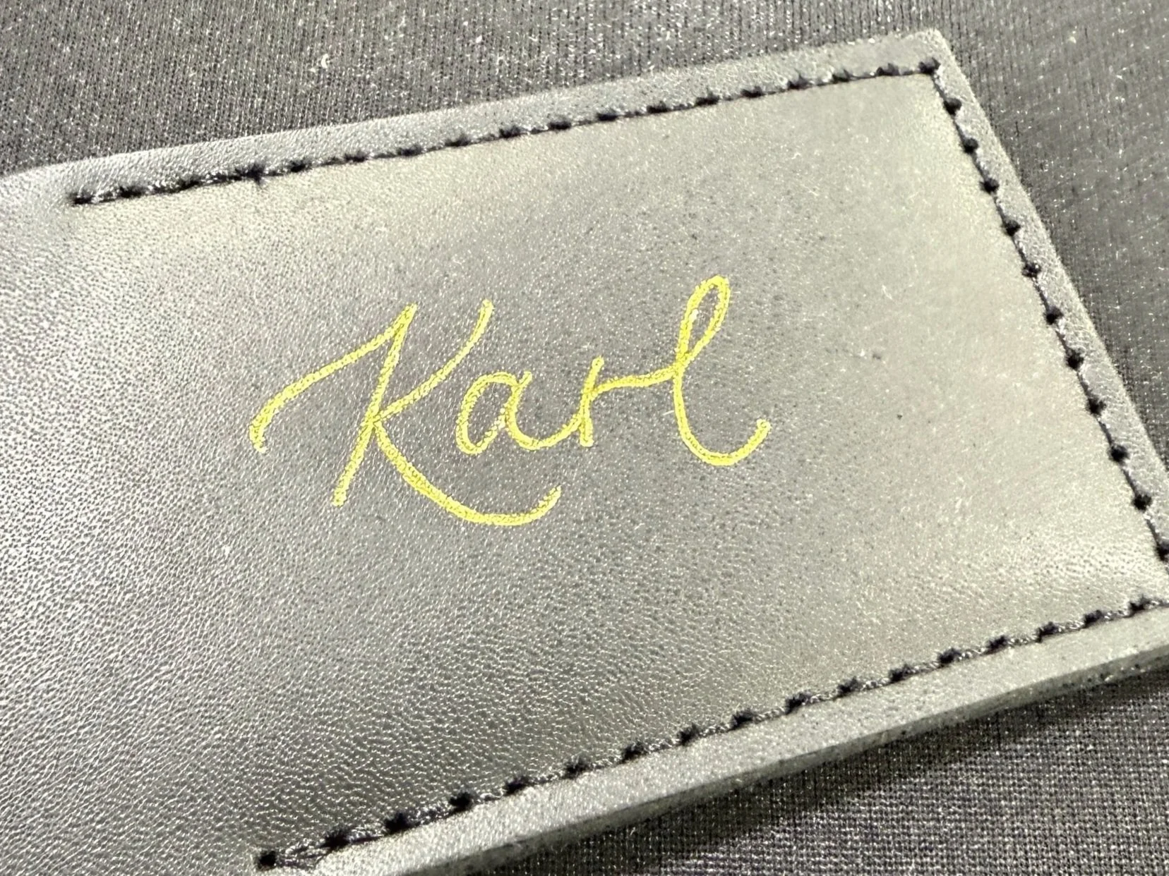 personalized hot foil calligraphy leather luggage tags hand-lettered for corporate event