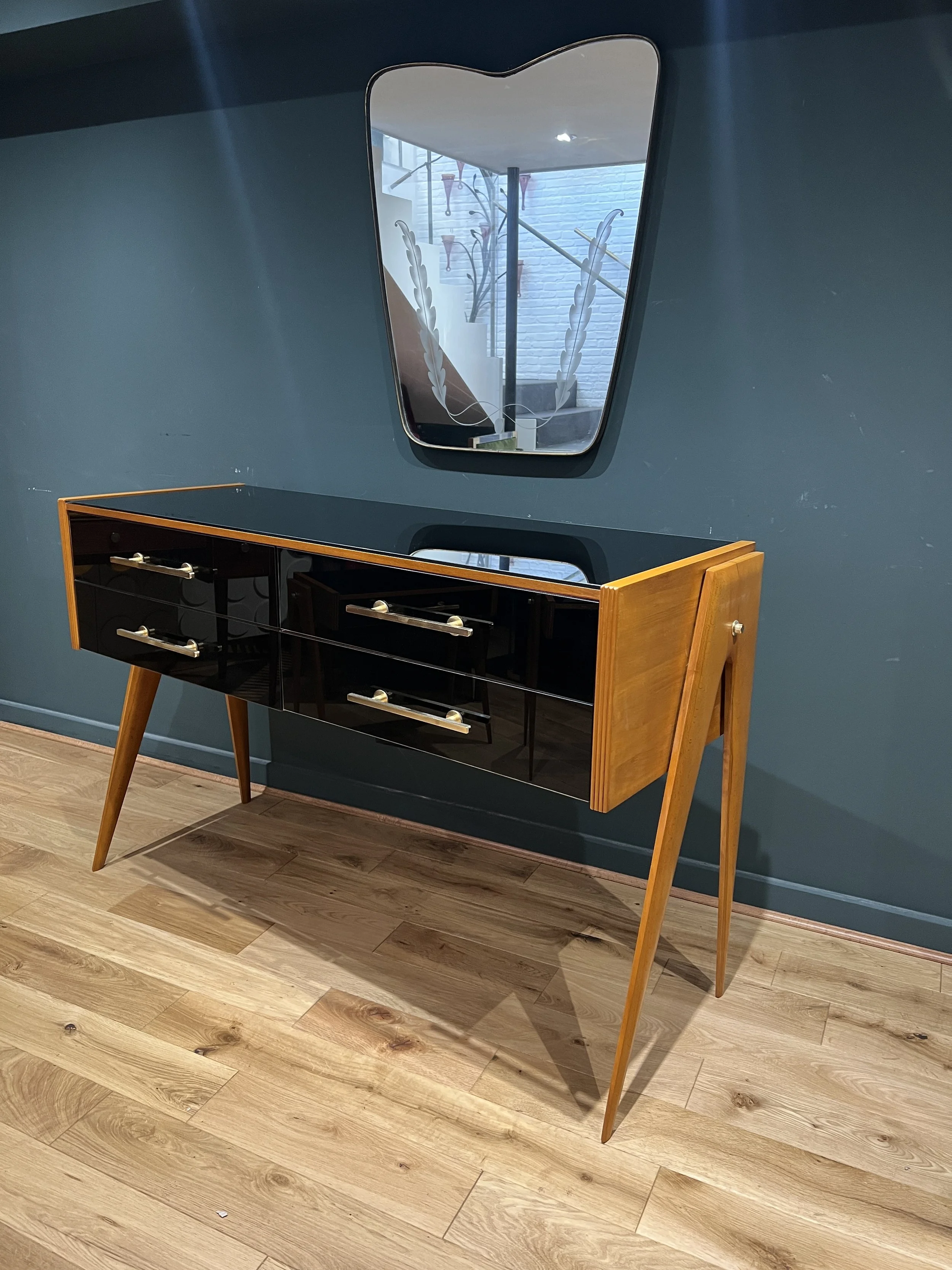 Italian four drawers black glass & wood commode