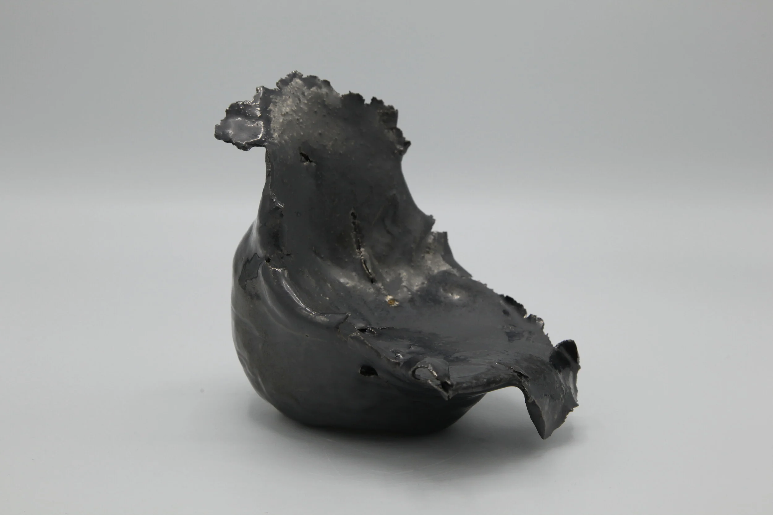   Phoenix Lindsey-Hall    Scream Inside Your Heart #11   2021   Bullet-pierced ceramic with gun metal metallic glaze   5 ¼ x 5 x 5 in 