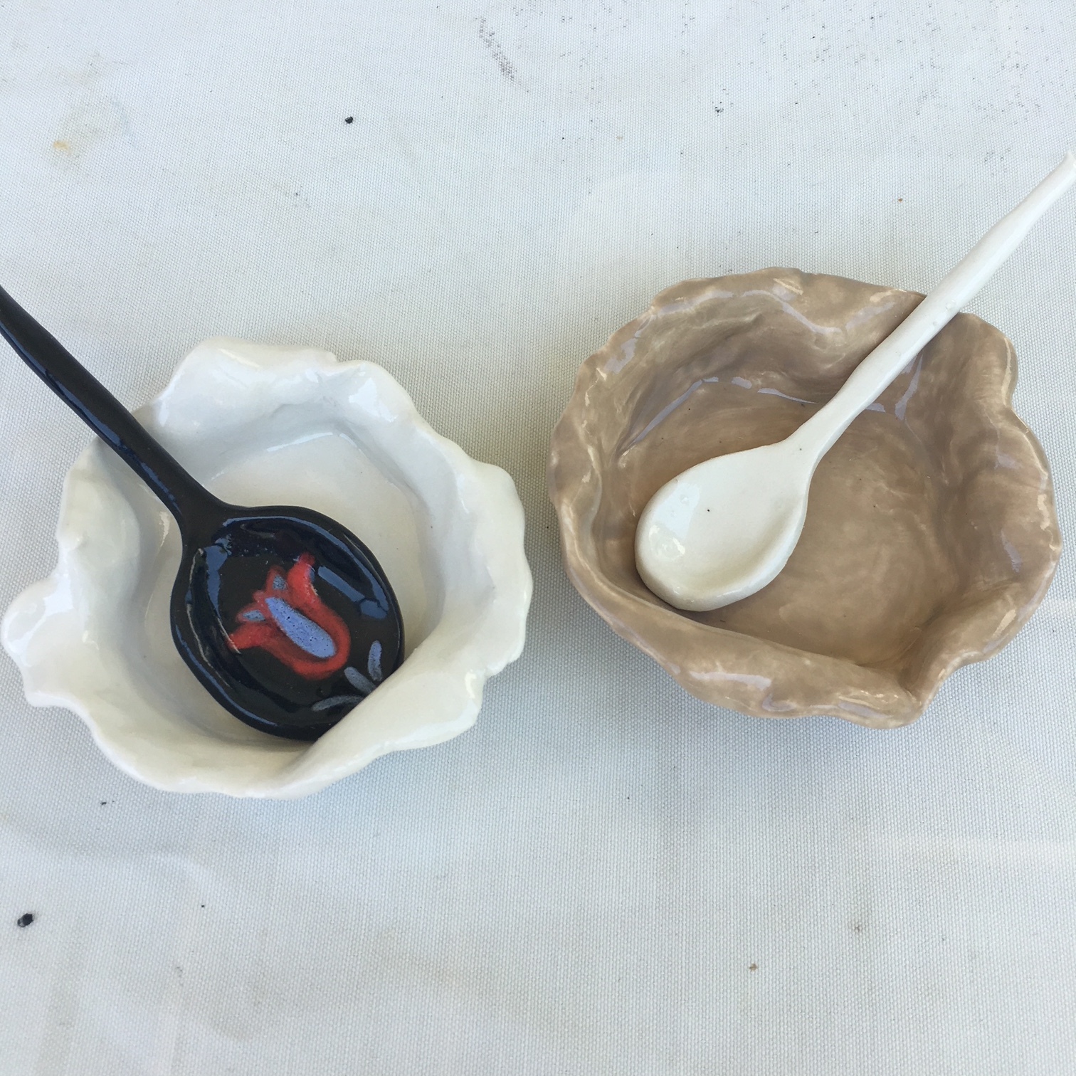 Salt cellars brown and white with spoons.JPG