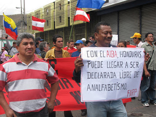 Signs reads "Con ALBA, Honduras can become declared a country free of illiteracy"