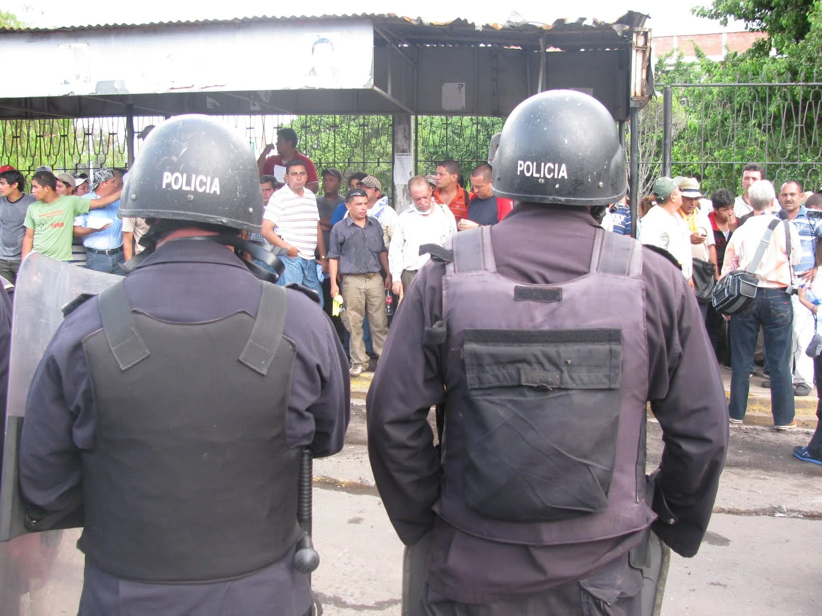 Police 'guarding' teachers and individuals they captured during violent eviction.