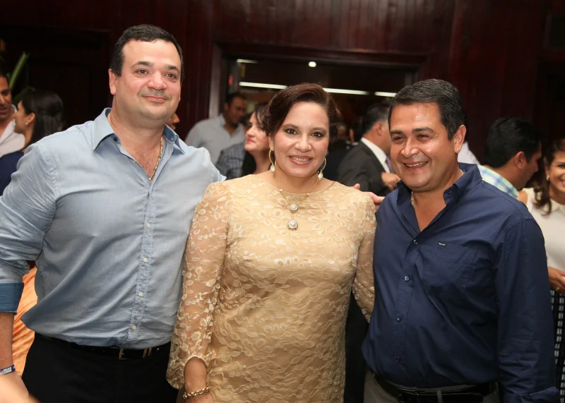 Photo caption: Yankel Rosenthal (left) with Ana Garcia Hernandez and current Honduran President Juan Orlando Hernandez.