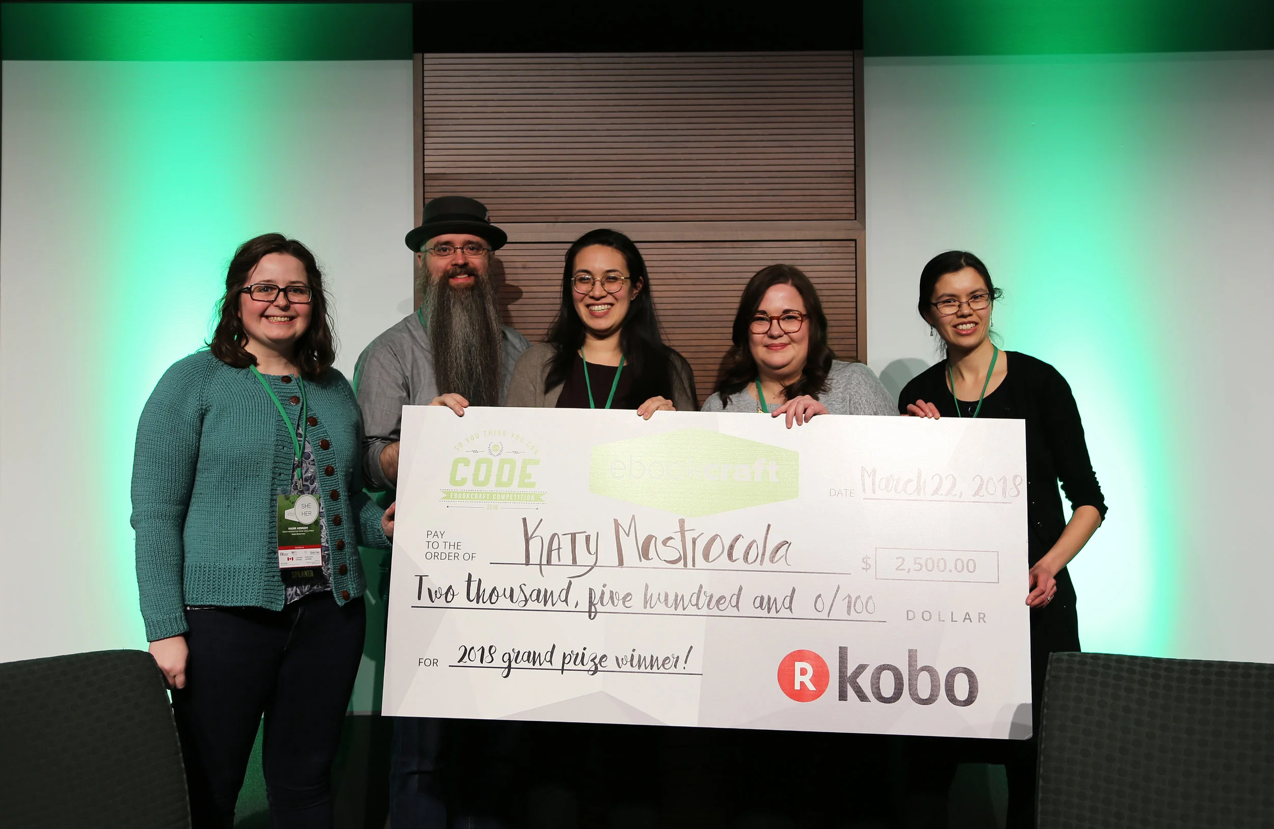 (L-R) Naomi Kennedy (judge), Joshua Tallent (judge), Melissa DeJesus (colleague from Houghton Mifflin Harcourt), Monique Mongeon (judge), and Teresa Elsey (colleague from Houghton Mifflin Harcourt) accepting Katy's cheque on her behalf. Photo by Yvonne Bambrick.