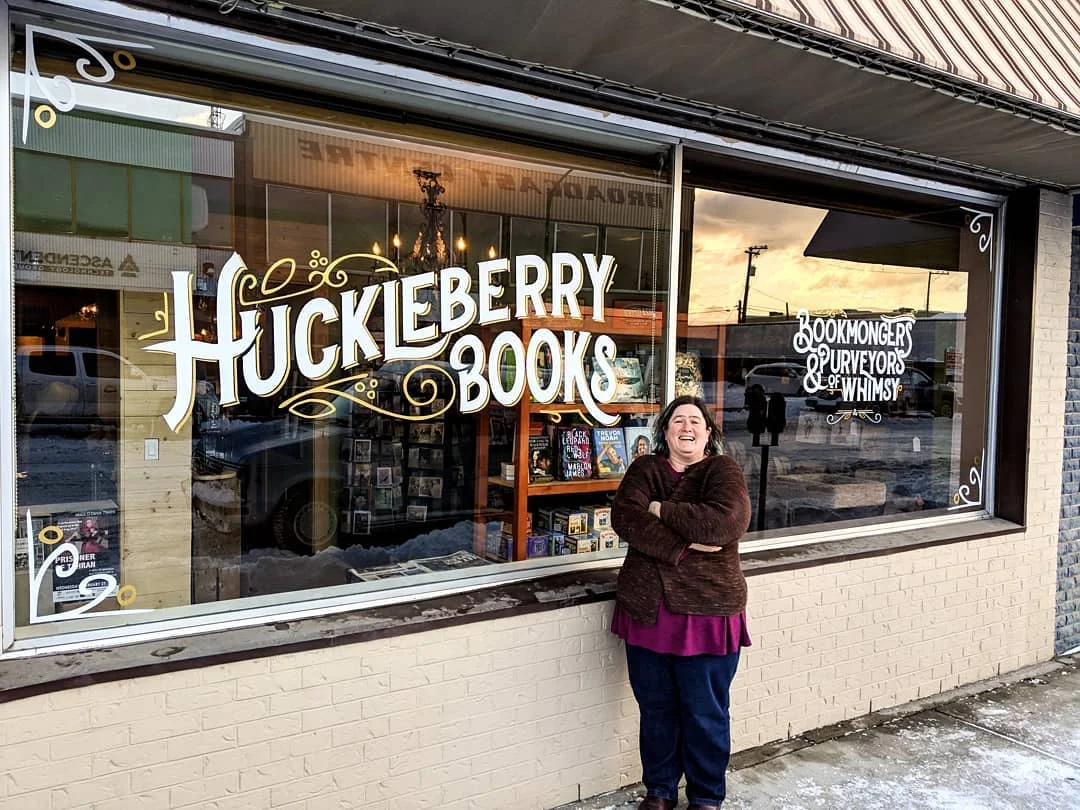 Photo of Erin Dalton outside the new Huckleberry Books store.