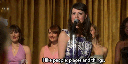  Gif of April Ludgate from the TV show Parks & Recreation at a beauty pageant saying “I like, people, places and things.” 