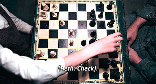 Animated GIF from The Queen's Gambit, young Beth is playing chess against Mr. Shaibel, she's seen moving  a pawn and saying Check - mate.