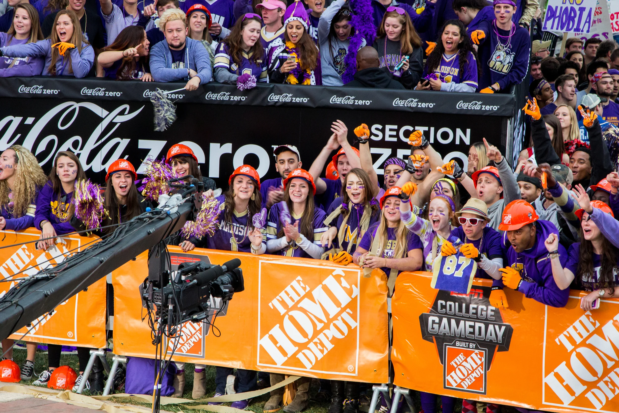 Students cheer as the camera pans across the crowd.