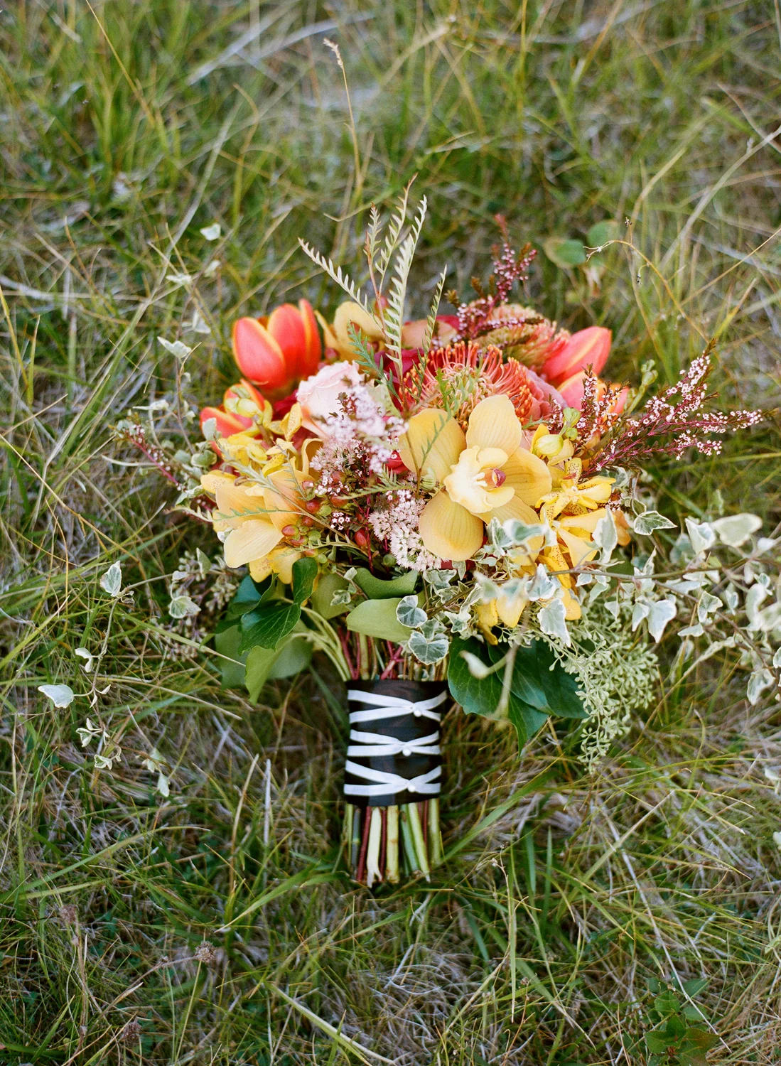 Fall bridal bouquet with red, yellow, green flowers