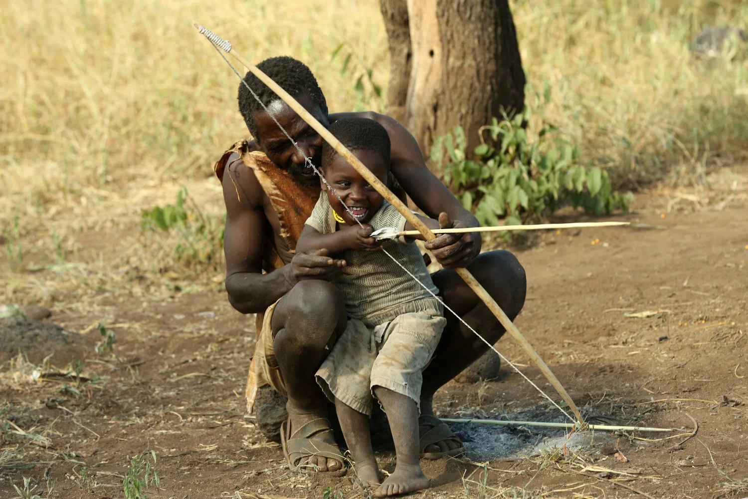 Fatherteaching+son+to+shoot.jpg