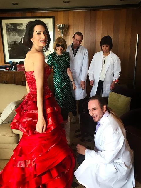 Amal Clooney getting couture treatment by John Galliano for Maison Margiela pre-Gala. Anna Wintour looks on.