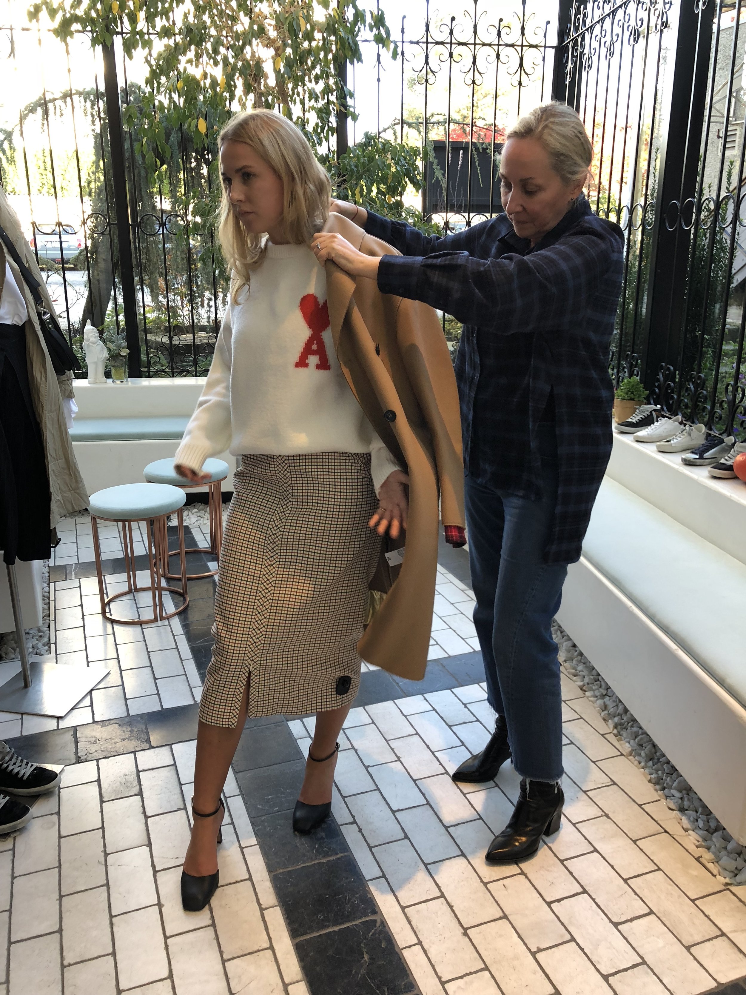 Modeled by her youngest (Elizabeth) . . . . . . a daytime outfit featuring No21 coat and skirt plus Ami Paris sweater.
