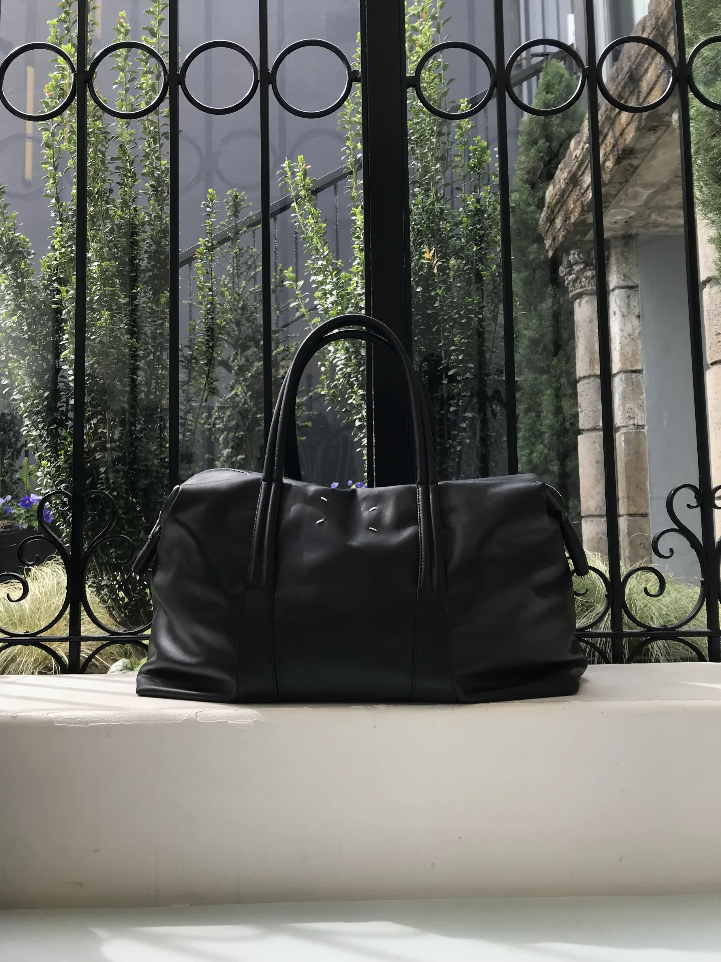 . . . but only if she can bring this Maison Margiela duffle bag.