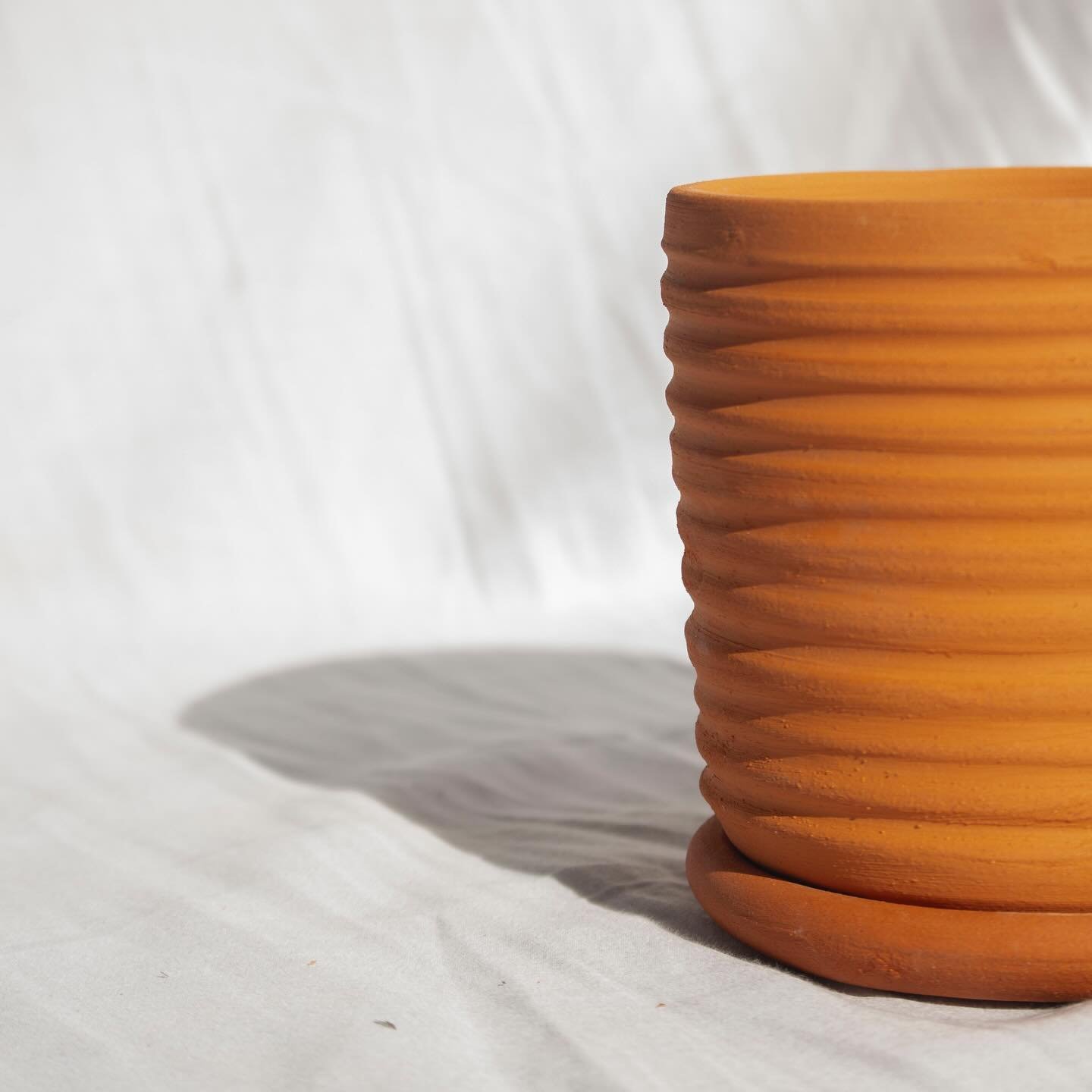 Ripple plant pot - wheel thrown terra cotta vessel for @oddbirdfair this weekend!
.
.
.
#terracotta #plantpot #pottery #ceramics #handmade #handmadepottery #modernceramics #handmadeceramics #yeg #yegmade #yegdesign #yegmaker #yegarts #visualvibes #ma