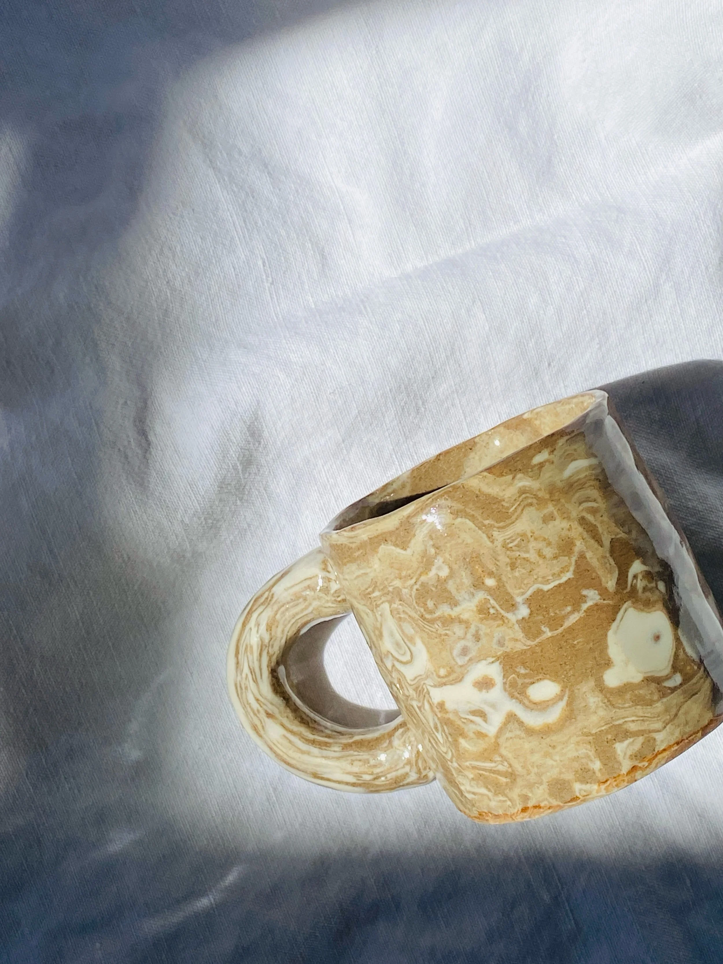Marbled espresso mug 🤌🏼
.
.
.
#marbledclay #espresso #minimug #handbuiltceramics