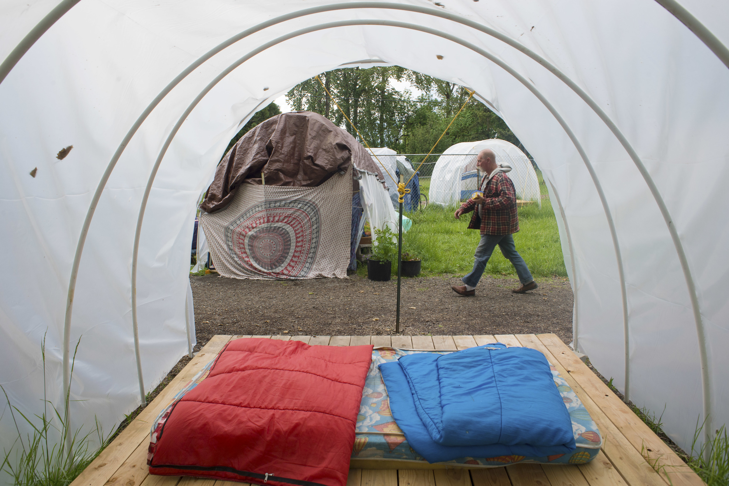 Eugene, Ore. - Mike Myers, site manager and resident of the Nightingale Health Sanctuary, helps maintain rules and structure within the camp. By: Debra Josephson