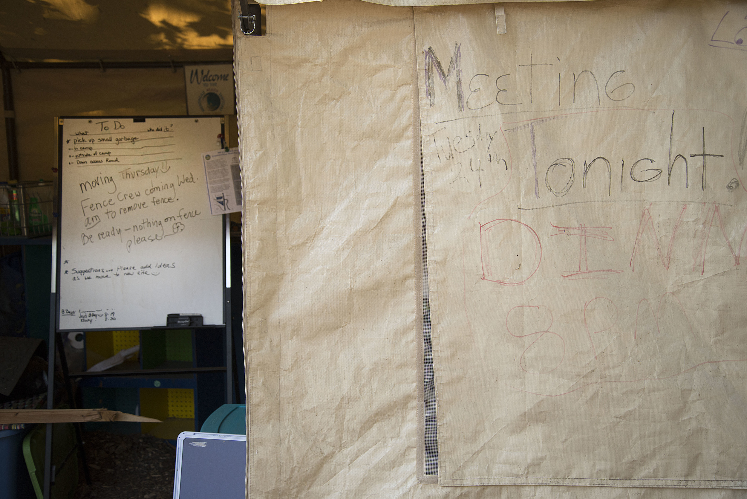 Eugene, ORE - A whiteboard in the office tent is typically used for sharing information about upcoming meeting topics or chores needed done at camp. By: Debra Josephson