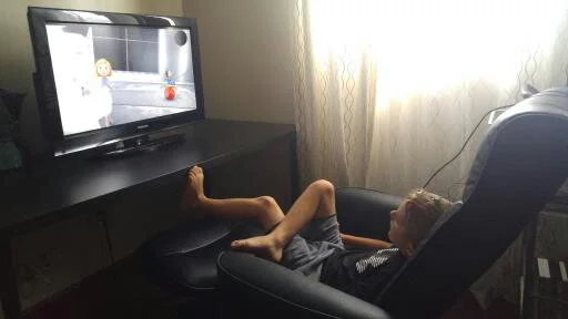 Jake enjoying watching a video during his neurofeedback session!