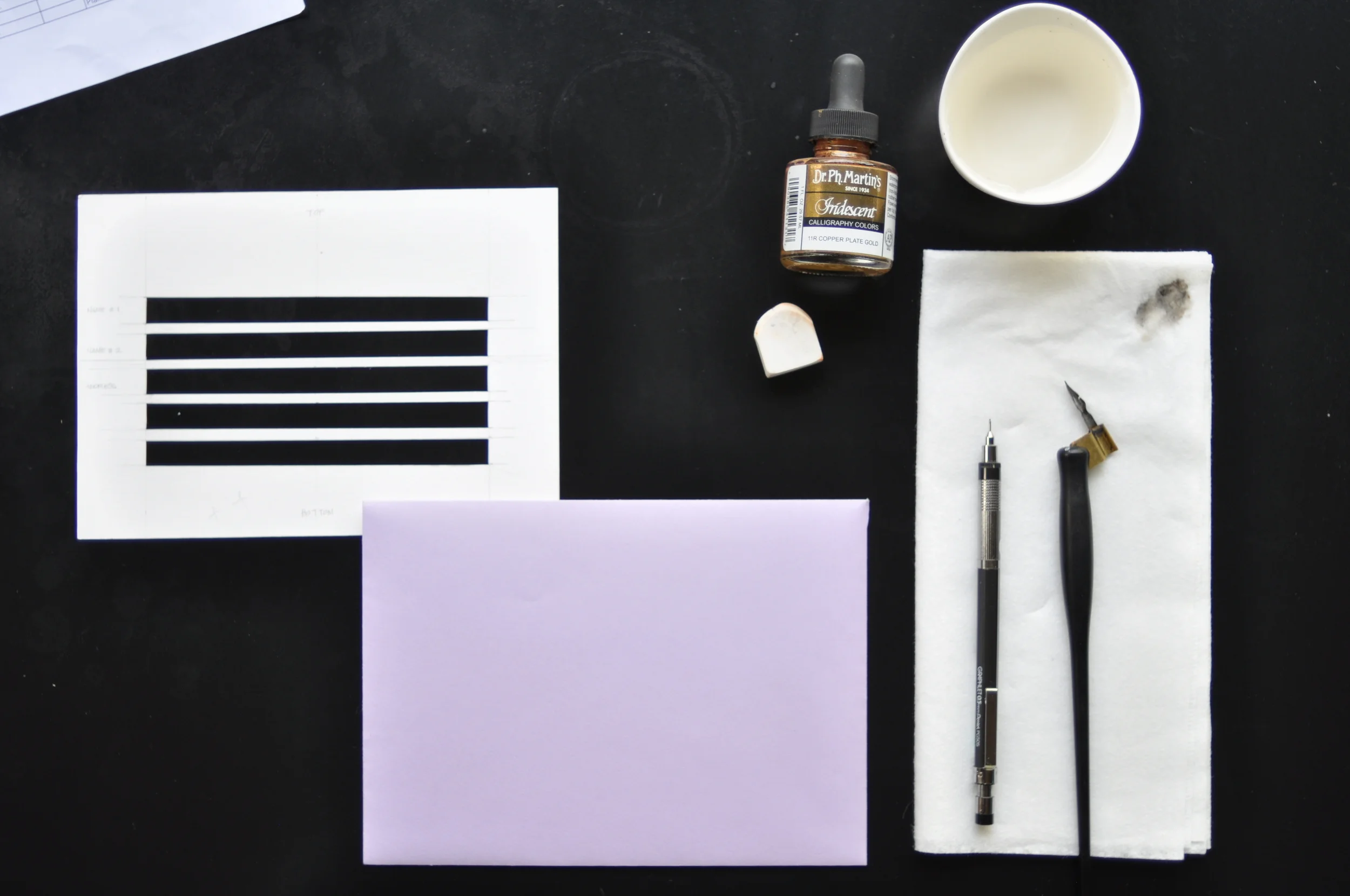 What you need: Cut-out template from heavy cardstock, a lead pencil, all the calligraphy necessities, and eraser to erase your guidelines.