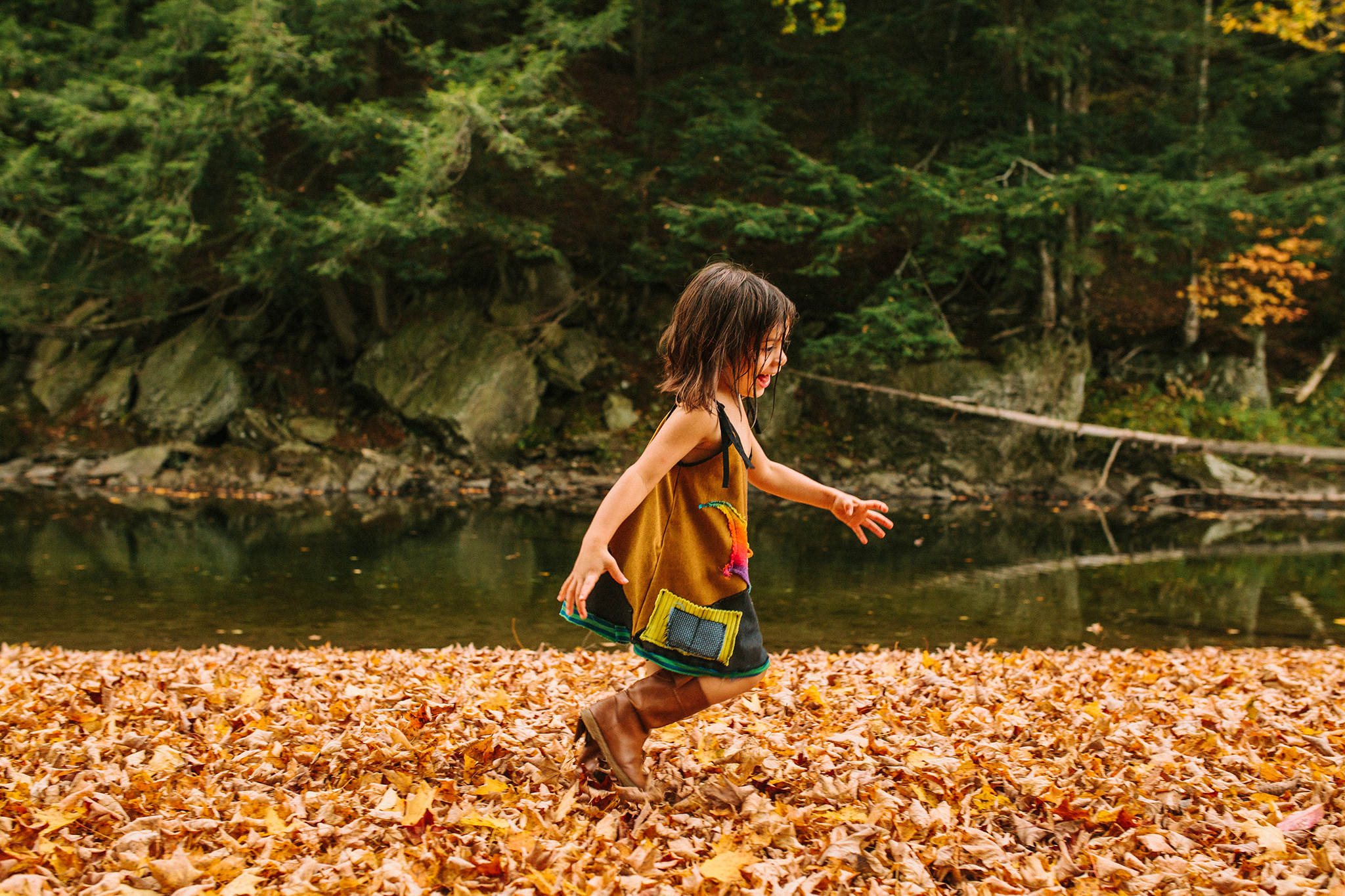 child playing in vermont autumn river web.jpg
