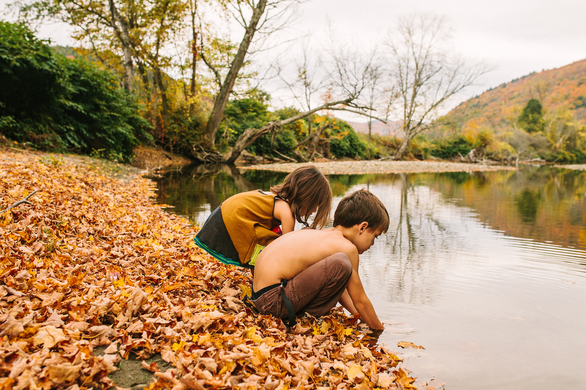 children playing in vermont river family session web.jpg