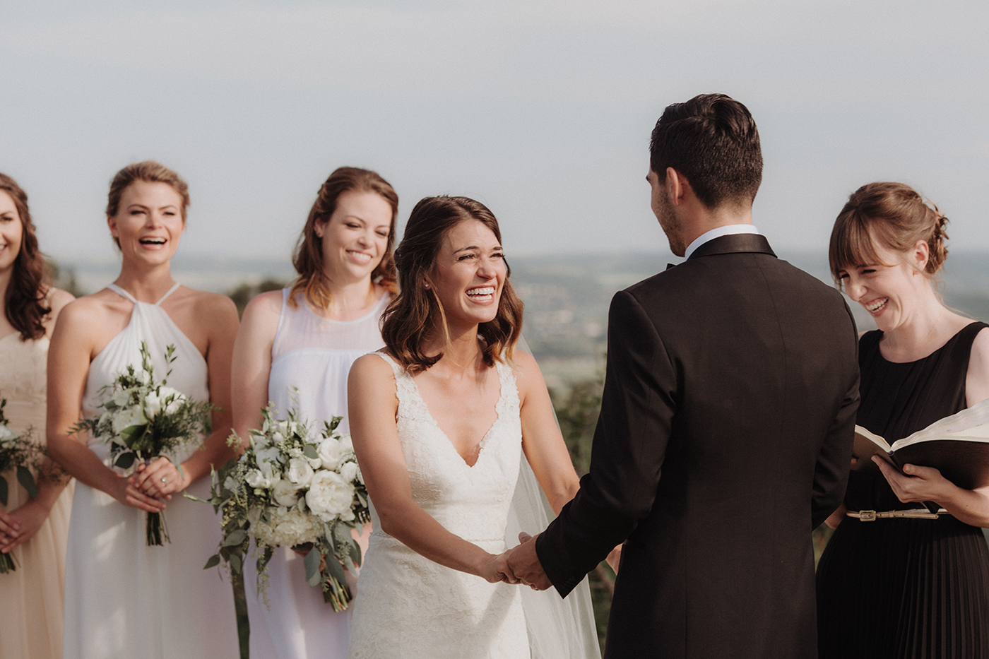  Bride and groom holding hands on wedding day 