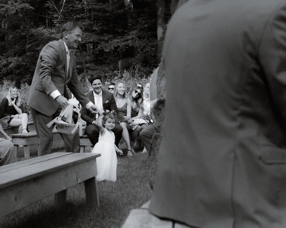 022_cameron-alexa-wedding-132_flower girl walking down isle .jpg