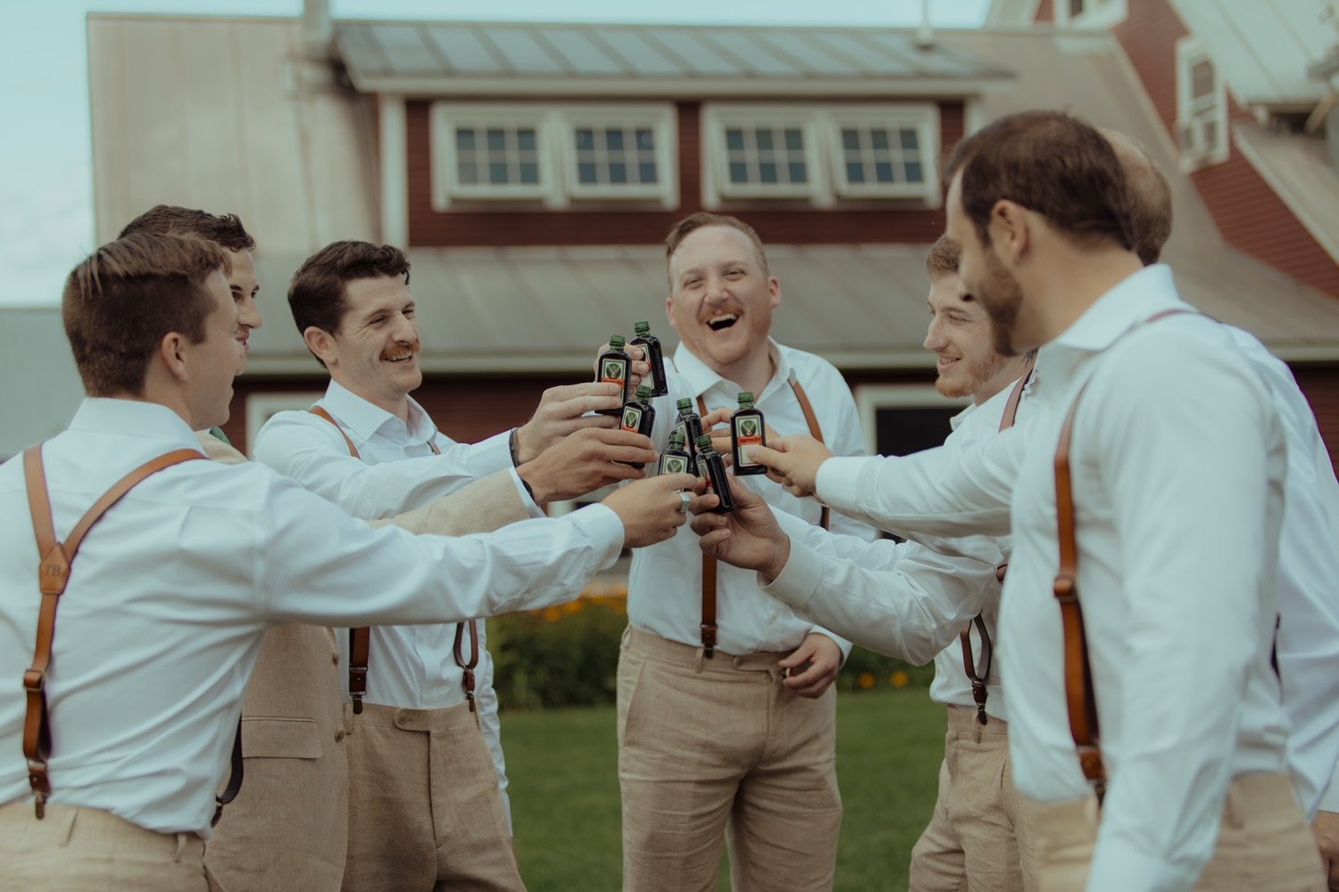 043_cameron-alexa-wedding-256_groomsmen cheersing.jpg