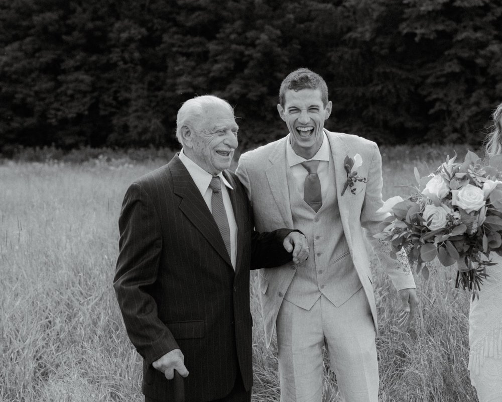 054_cameron-alexa-wedding-304_groom and grandfather laughing .jpg