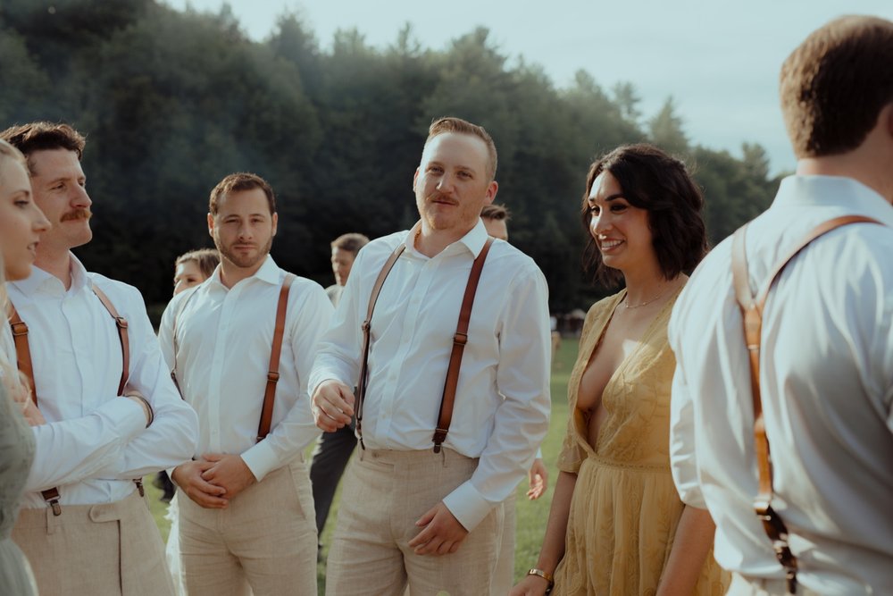 071_cameron-alexa-wedding-468_groomsmen suspenders timeless wedding .jpg