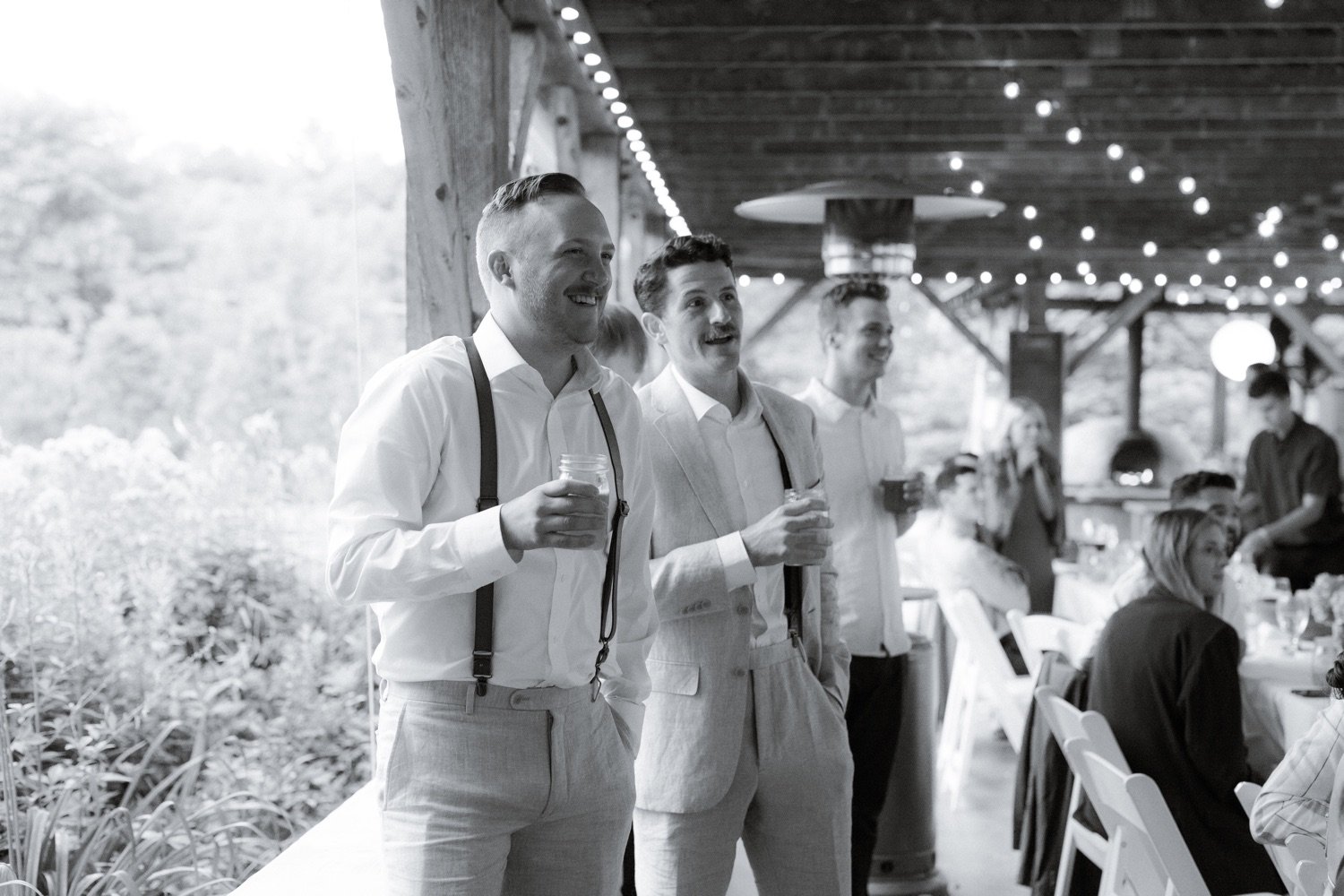 110_cameron-alexa-wedding-661_groomsmen candid smiling .jpg