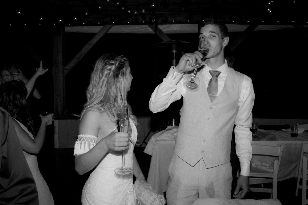 118_cameron-alexa-wedding-718_bride groom drinking .jpg