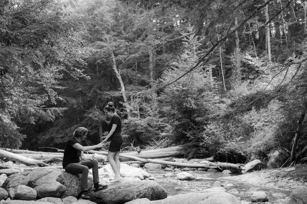 21_black and white photo of a couple by the river in the green mountain national forest .jpg