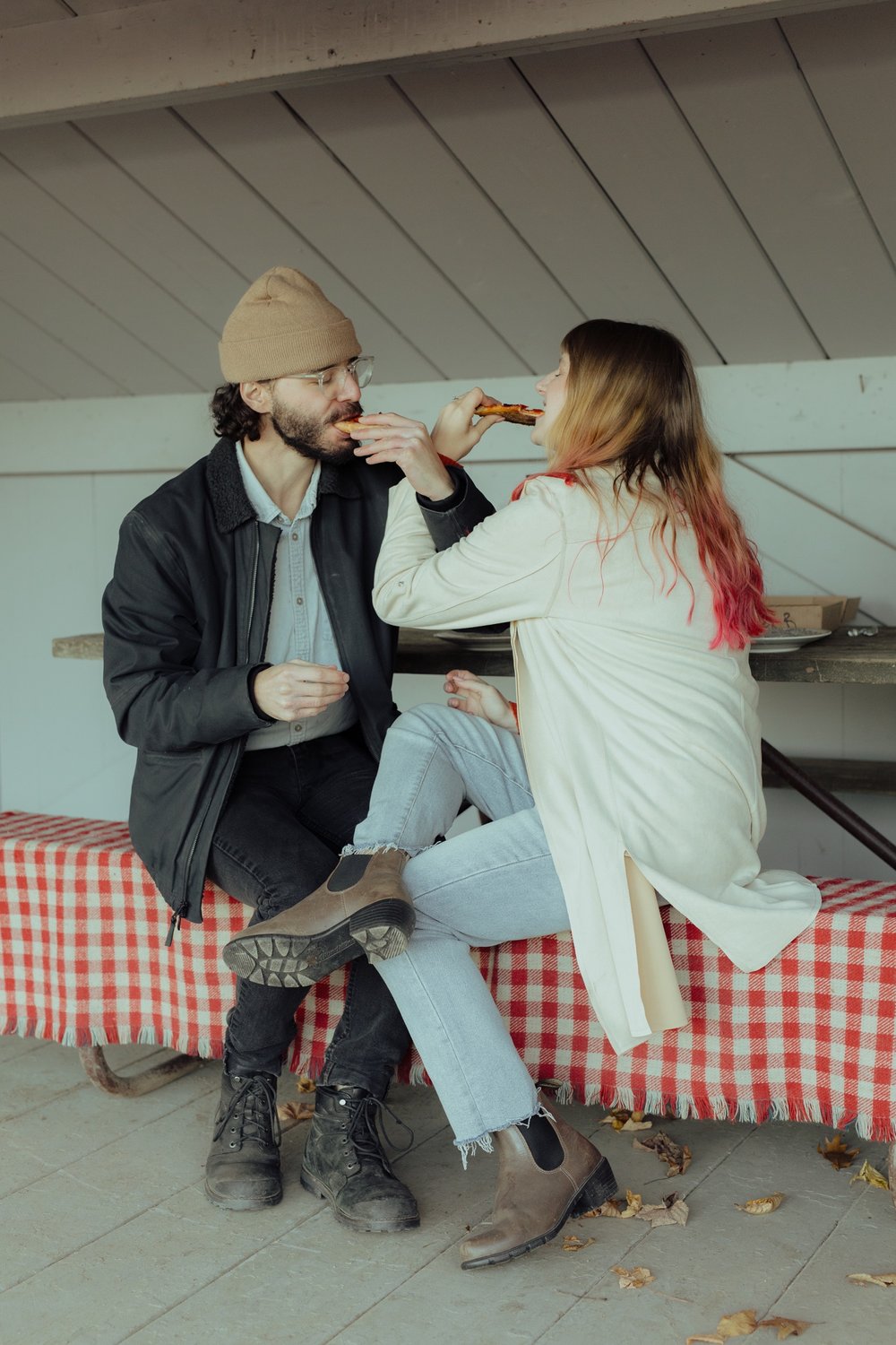 30_couple eating a pizza picnic together in a lean-to at grand isle state park vermont .jpg