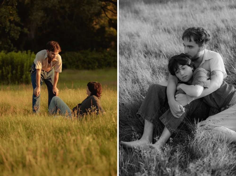 38_woman lays in tall grass during golden hour in vermont while boyfriend talks to her _young couple cuddled up in each others arms in the tall grass in vermont summer black and white .jpg