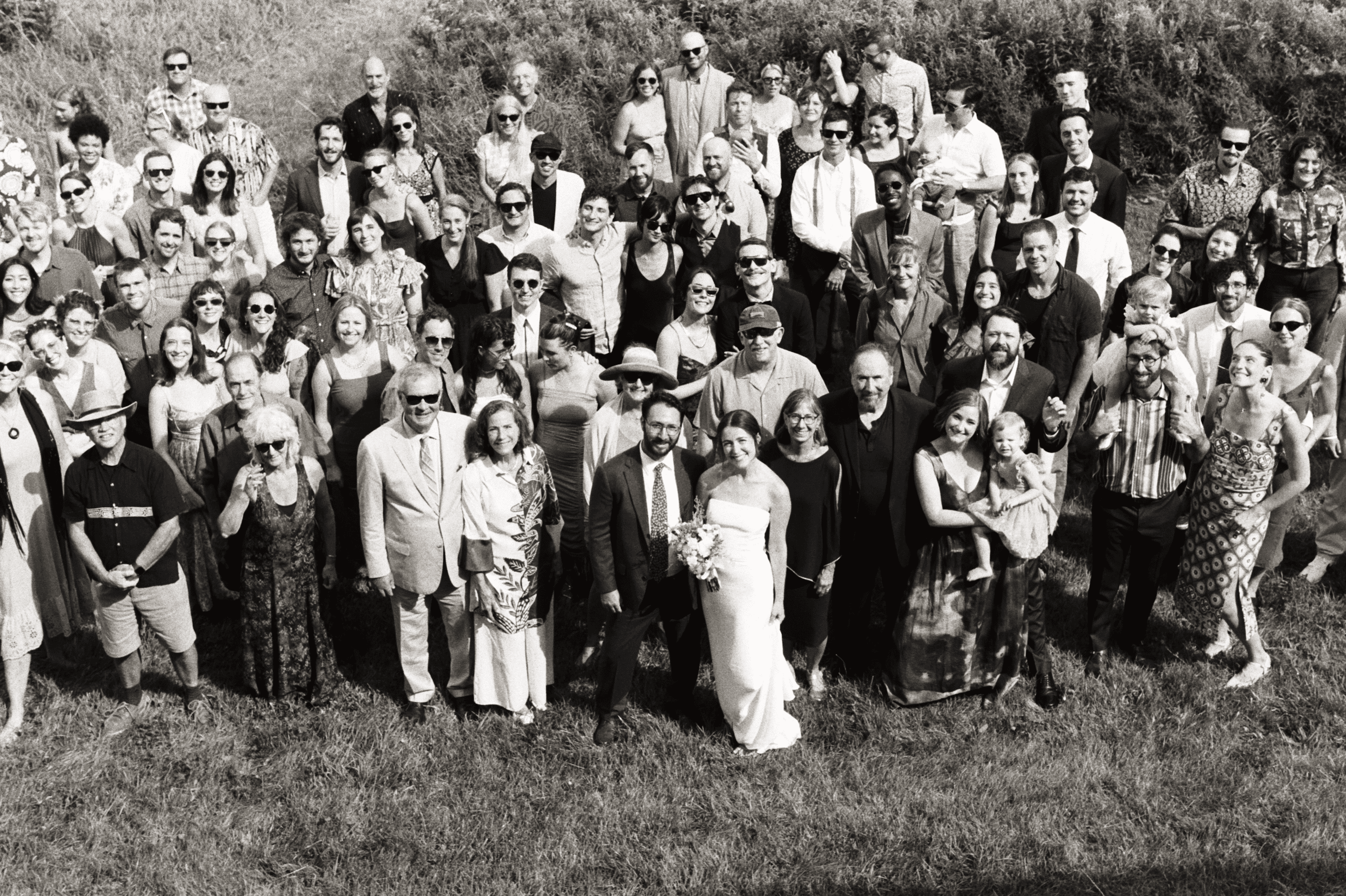 large wedding guest group photo taken with black and white film by vermont photographer jacquelyn potter
