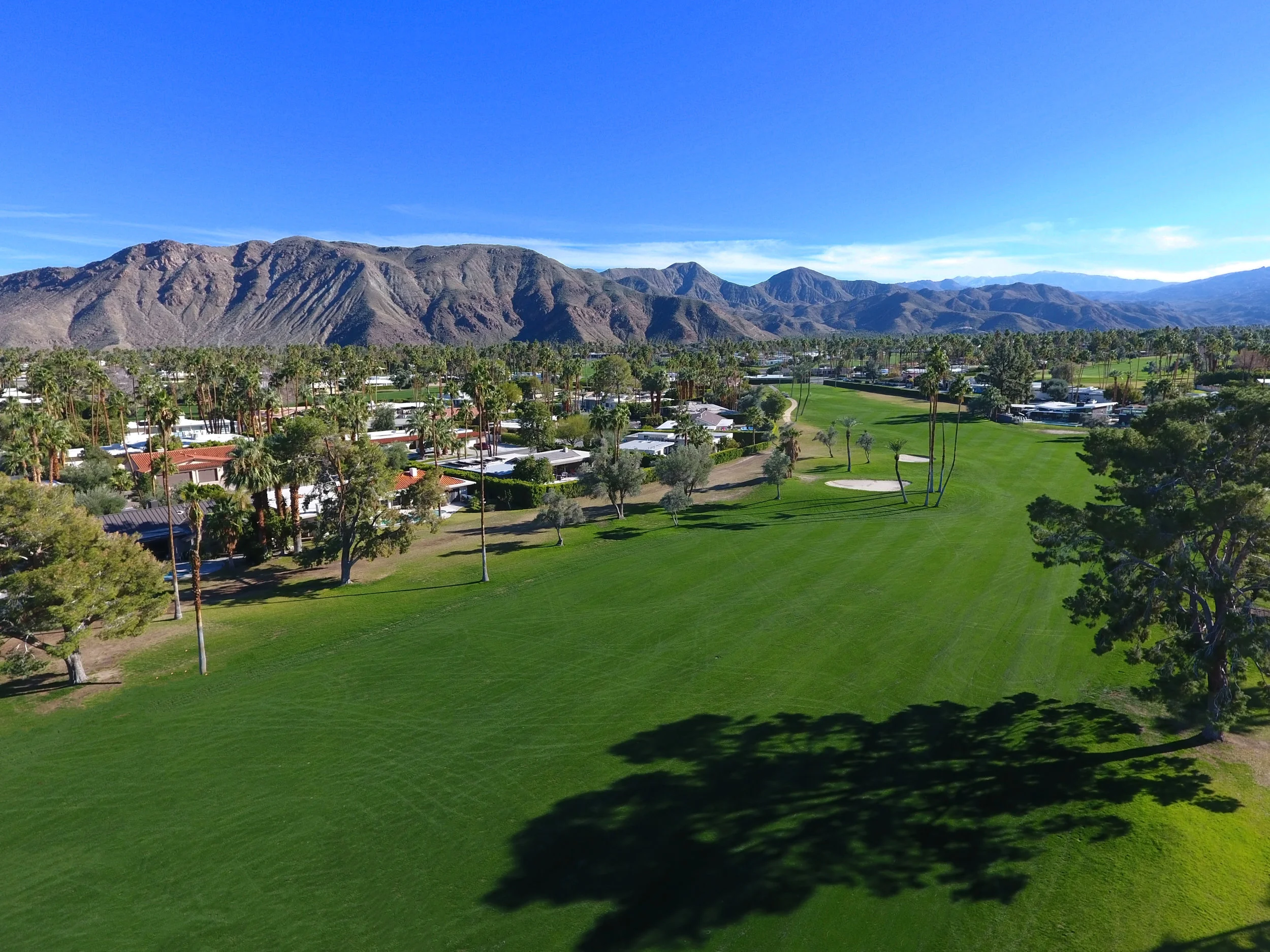 GOLF COURSE TO MOUNTAINS DRONE.jpg
