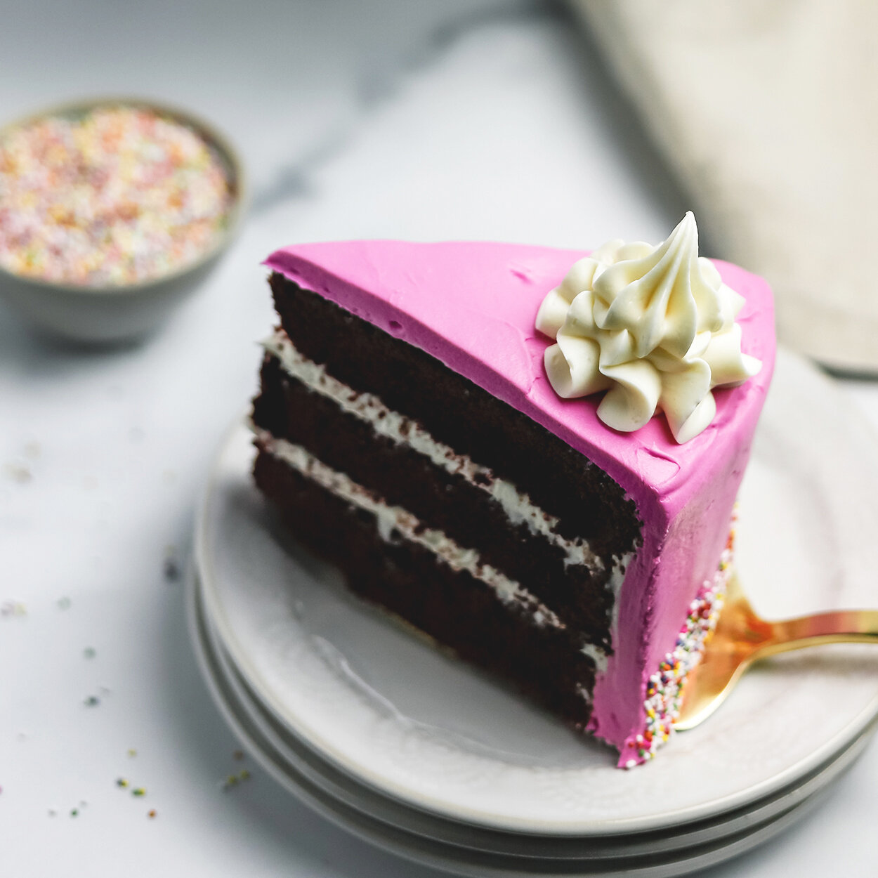 https://images.squarespace-cdn.com/content/v1/55045bd7e4b07d153dcc98de/1624148396981-TDIX1PE1M7Z69E188PN3/PinkCake_Slice_web.jpg