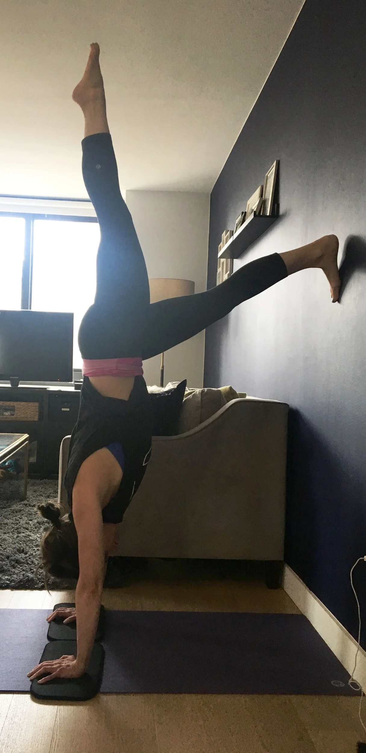 My friend Sarah getting weightless with the wall. Almost ready for free standing handstands!